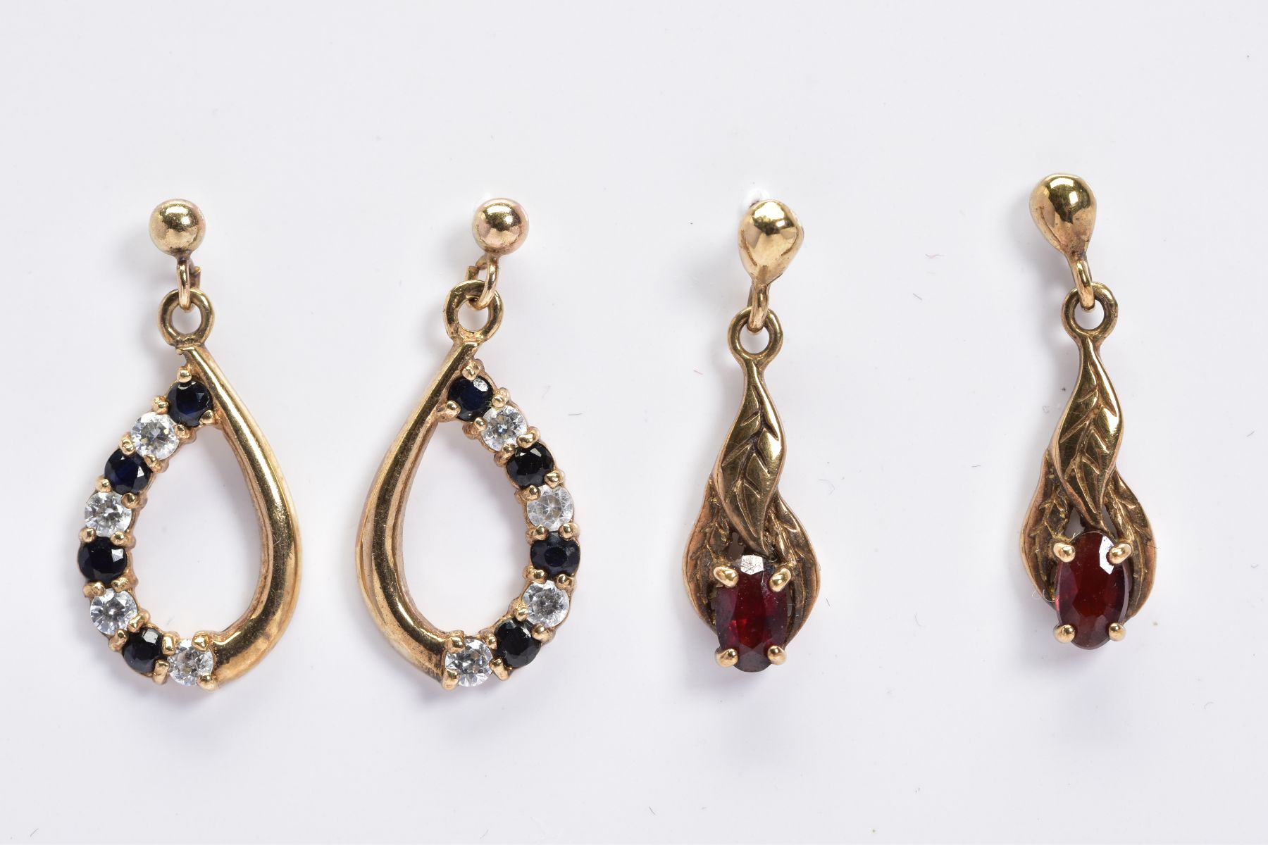 TWO PAIRS OF 9CT GOLD GEM SET DROP EARRINGS, the first of foliate design set with an oval garnet, - Image 2 of 2
