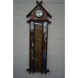 A LATE VICTORIAN WALNUT ADMIRAL FITZROY CLOCK/BAROMETER flanked by rectrangular mirrors 45.5cm x