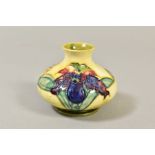 A SMALL MOORCROFT POTTERY SQUAT VASE, 'Orchid' pattern on yellow ground, impressed and painted