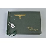 A GREEN COLOURED BOUND GERMAN 3RD REICH WEHRMACHT PHOTO ALBUM, 'Meine Dienftzgeif' My Tour or My