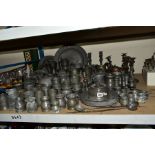 A QUANTITY OF PEWTER, mostly 19th Century, including tankards, teapots, candlesticks, plates,