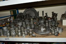 A QUANTITY OF PEWTER, mostly 19th Century, including tankards, teapots, candlesticks, plates,