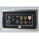 A GLAZED FRAME CONTAINING THE FOLLOWING MEDALS, WWI German Iron Cross (replica), German WWI