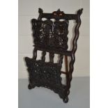 A LATE 19TH/EARLY 20TH CENTURY ANGLO INDIAN HARDWOOD FOLDING MAGAZINE STAND on an easel back, the