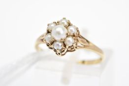 A 9CT GOLD SPLIT PEARL CLUSTER RING, designed as a tiered cluster of claw set split pearls to the
