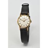 A 9CT GOLD LADIES OMEGA WRISTWATCH, silvered dial with gold coloured baton markers and black baton