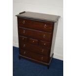 A STAG MINSTREL CHEST OF SEVEN DRAWERS, width 82cm x depth 46cm x height 112cm