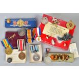 A TIN CONTAINING A GROUP OF FOUR WWI ERA AND LATER MEDALS named to W G (George) Braddy, British