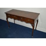 A REPRODUCTION MAHOGANY SIDE TABLE with two long drawers on cabriole legs, width 123cm x depth