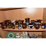 A COLLECTION OF SEVENTEEN VICTORIAN COPPER LUSTRE JUGS, BOWLS AND TANKARD, most with hand painted