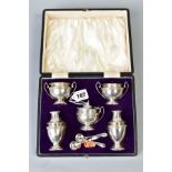 A CASED WALKER AND HALL SILVER EIGHT PIECE CRUET SET, comprising a pair of pepperettes, a covered