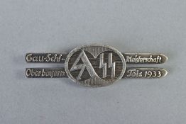WWII GERMAN S.A./S.S. RALLY BADGE/TINNIE, design features a pair of parallel skis with centre