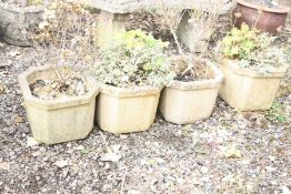 FOUR COMPOSITE GARDEN PLANTERS with eight sides, width 38cm x height 30cm