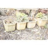 FOUR COMPOSITE GARDEN PLANTERS with eight sides, width 38cm x height 30cm