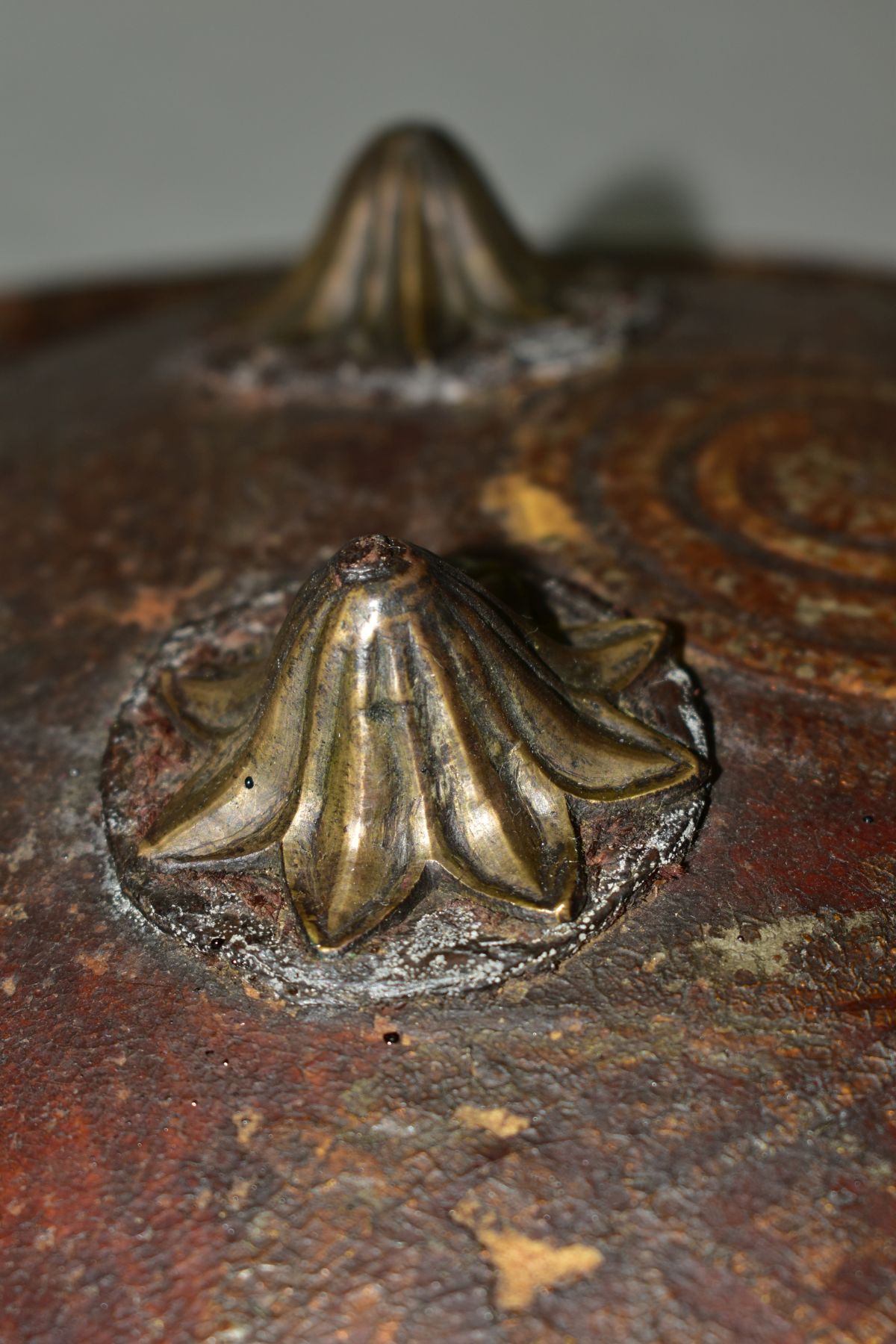 AN INDIAN LEATHER SHEILD WITH FOUR IRON BOSSES, probably 19th Century, leather straps verso and - Image 3 of 5