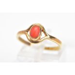A 9CT GOLD CABOCHON RING, the oval coral imitation cabochin within a collet setting to the