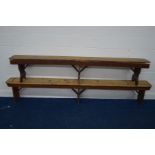 TWO EARLY 20TH CENTURY PITCH PINE BENCHES, longest bench 270cm