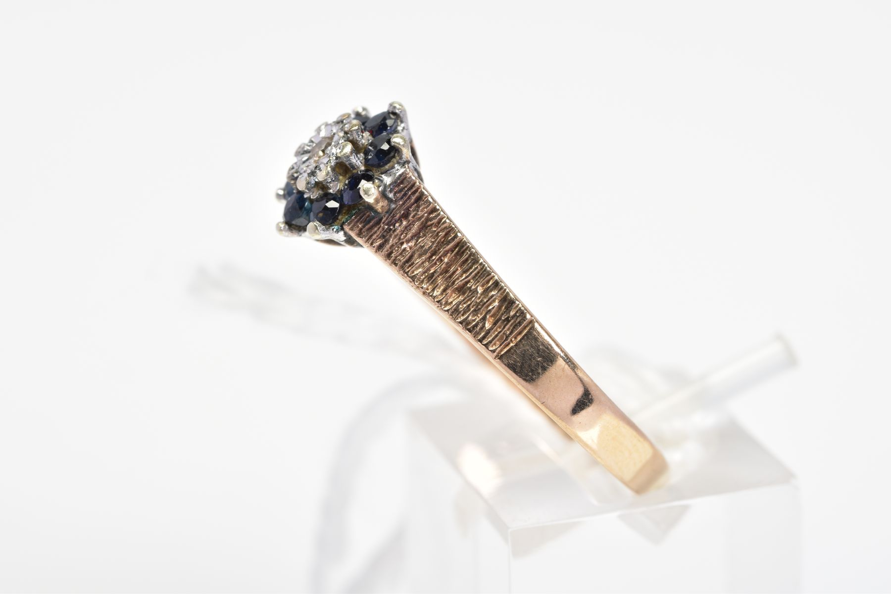 A 9CT GOLD SAPPHIRE AND DIAMOND CLUSTER RING, the central single cut diamond in an illusion - Image 2 of 3