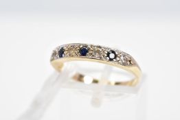 A 9CT GOLD SAPPHIRE AND CUBIC ZIRCONIA RING, designed as a line of four colourless cubic zirconias