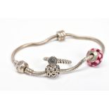 A PANDORA CHARM BRACELET AND RING, the charm bracelet suspending two charms and a spacer charm,