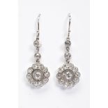 A PAIR OF DIAMOND DROP EARRINGS, a round open work cluster of old European cut diamonds, suspended