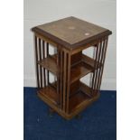 A LATE 19TH CENTURY ROSEWOOD AND INLAID TWO TIER REVOLVING BOOKCASE on casters, 49cm squared x