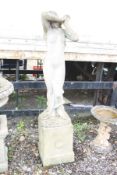 A LARGE COMPOSITE GARDEN FIGURE OF LADY on a square column base with laurel detail to each facet,