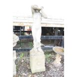 A LARGE COMPOSITE GARDEN FIGURE OF LADY on a square column base with laurel detail to each facet,