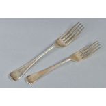 A GEORGE V SILVER OLD ENGLISH PATTERN TABLE FORK AND MATCHING DESSERT FORK, both engraved with