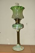 A LATE 19TH CENTURY OIL LAMP, wavy green, opaque and clear acid etched shade, iridescent and pale