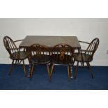 A DARK ERCOL DRAW LEAF DINING TABLE, width 114cm x depth 71cm x height 74cm (sd) and four chairs