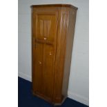 A GOLDEN OAK LINENFOLD HALL ROBE, width 79cm x depth 41cm x height 186cm