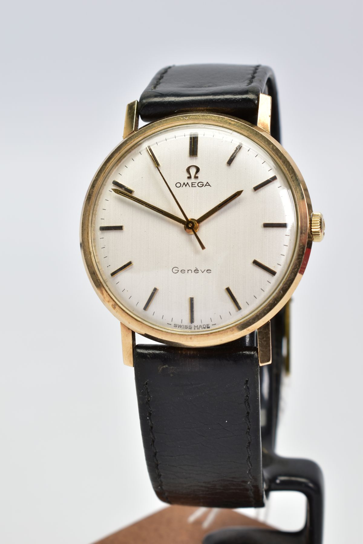 A 9CT GOLD CASED OMEGA WRISTWATCH, silvered dial with gold batons and hands, hand wound movement,