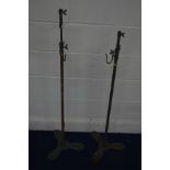 TWO MATCHING EARLY 20TH CENTURY INDUSTRIAL CAST IRON TELESCOPIC STAND on a propeller shaped base,