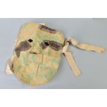 A GERMAN WWI/II ERA CANVAS/CLOTH CAMOFLOUGE SNIPER MASK, to be worn under the helmet etc, faded