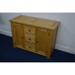 A MODERN LIGHT OAK SIDEBOARD, with three central deep drawers, width 110cm x depth 50cm x height