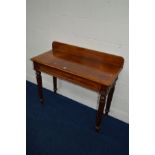A VICTORIAN WALNUT SIDE TABLE with a raised back and a single long drawer on four fluted legs, width