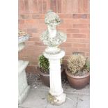 A COMPOSITE GARDEN BUST OF A LADY standing atop of a fluted column (some losses) height 124cm