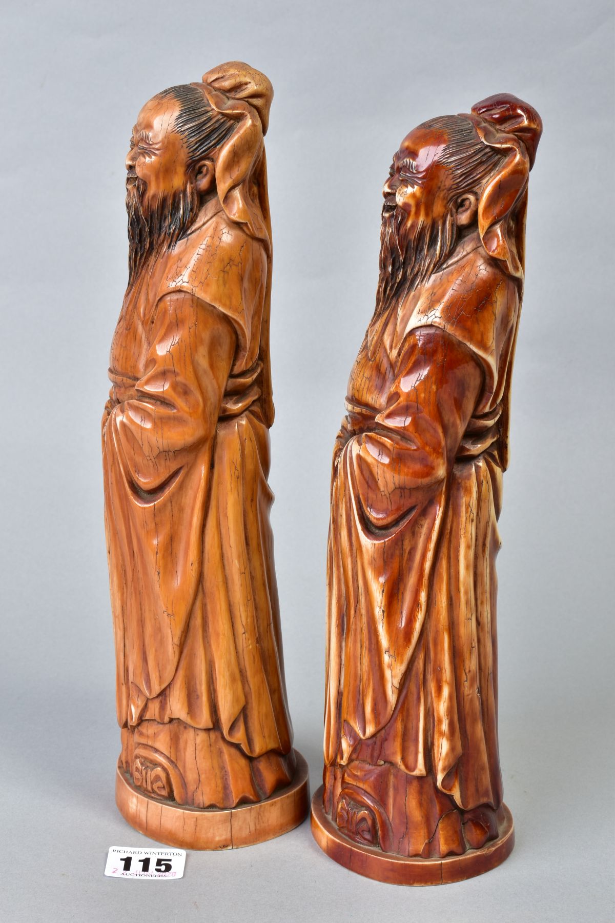 TWO NEAR IDENTICAL CHINESE CARVED AND BROWN STAINED IVORY FIGURES OF IMMORTALS, on oval bases with - Image 2 of 6