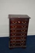 A MODERN MAHOGANY CHEST OF SEVEN DRAWERS with brushing slide and brass swan necked handles