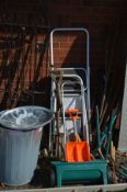 A QUANTITY OF VINTAGE GARDEN TOOLS together with two step ladders and a galvanised bin