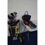 A GOLF BAG containing various clubs and other accessories including an M D Golf Superstring 460