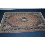 A LATE 20TH CENTURY SIVAS STYLE WOOLLEN GROUND RUG, 280cm x 180cm together with a peach and blue rug