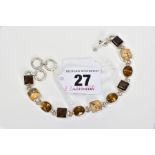 A MULTI GEM BRACELET, designed with collet set gems including square smokey quartz and oval citrine,