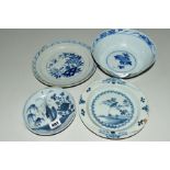 A CHINESE BLUE AND WHITE SAUCER DISH, painted underglaze with flowers and foliage, bears handwritten