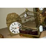 A VICTORIAN BRASS BIRD CAGE, with some of its original glass inserts, pull out drawer, on knapped