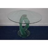 A CIRCULAR GLASS DINING TABLE, on a shaped twisting base, diameter 106cm x height 77cm