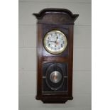 AN EARLY 20TH CENTURY MAHOGANY WALL CLOCK together with an oak wall clock (2)