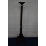 A LATE 20TH CENTURY MAHOGANY TORCHERE STAND with a circular top on a cylindrical fluted upright