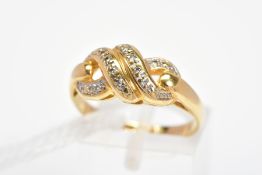 A 9CT GOLD DIAMOND DRESS RING, of knot design set with brilliant cut diamonds, with 9ct hallmark,